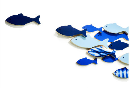 Abstract image of blue fish shapes on a white background, showcasing movement and contrast in minimalist design.の写真素材