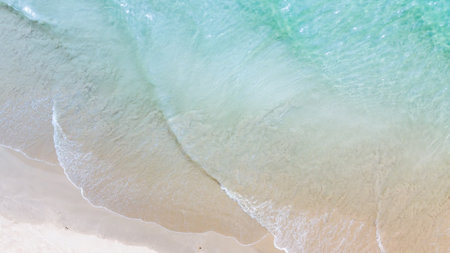 Soft wave of the sea on the sandy beach. Summer background.の写真素材