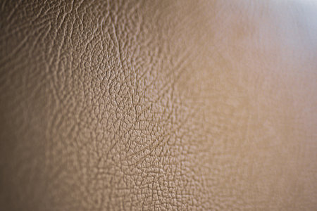 High-resolution image showcasing the detailed texture of brown leather, perfect for backgrounds or...