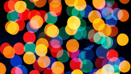 A colorful bokeh background featuring defocused lights in various vibrant hues, perfect for festive and creative designs.の写真素材
