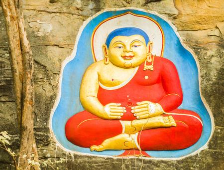 Buddha status on the wallの写真素材