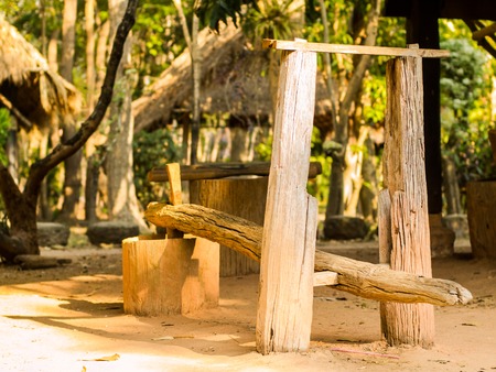 Wooden mortar and pestle for grinding riceの写真素材