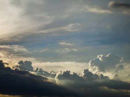 Dark clouds drifted lower before the rain.の写真素材