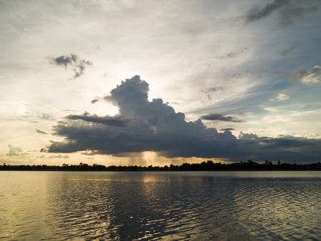 Dark clouds drifted lower before the rain.の写真素材