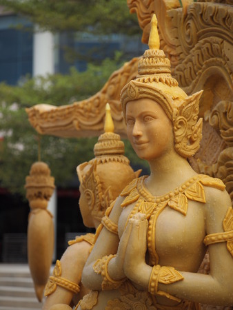 Candle wax carving angel Thai style in the traditional parade active festival Buddhist Lent in Nakhon Ratchasima, Thailand.の写真素材