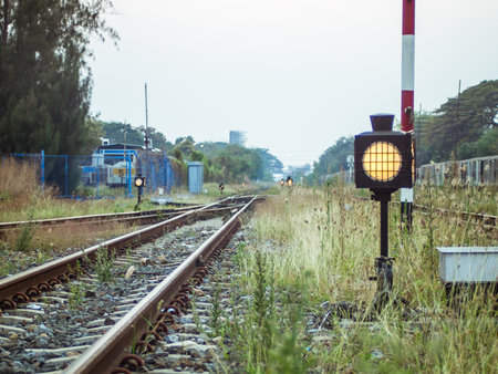 Railway tracks and traffic light in the morning. Vintage style.