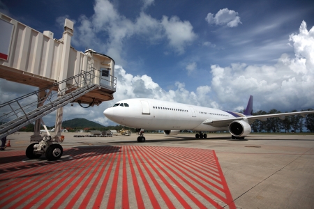 Parked aircraft parked in the airport waiting for passengers の写真素材