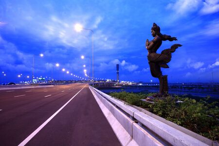 apsonsi-thai magnificent statue against cloudy sky backgroundの写真素材