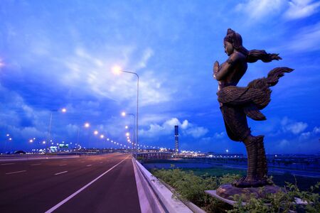 apsonsi-thai magnificent statue against cloudy sky backgroundの写真素材