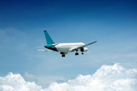 Airplane on blue sky の写真素材