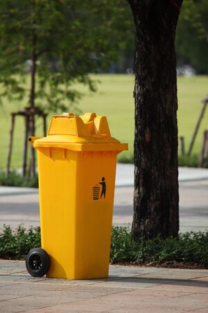 trash can yellow in park の写真素材