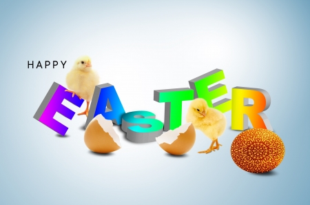 A fluffy yellow chick coming out of an easter egg shellの写真素材