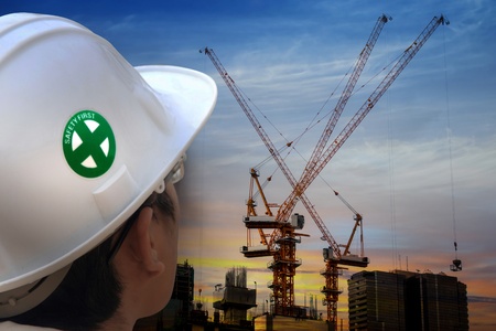 Worker and construction in backgroundの写真素材