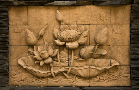 A stone inscription of a flower, Thai style of buddhismの写真素材