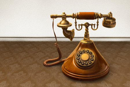 Vintage telephone over striped wallpaperの写真素材