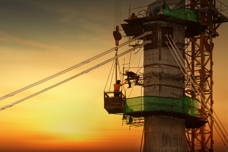 silhouette of construction worker on construction siteの写真素材