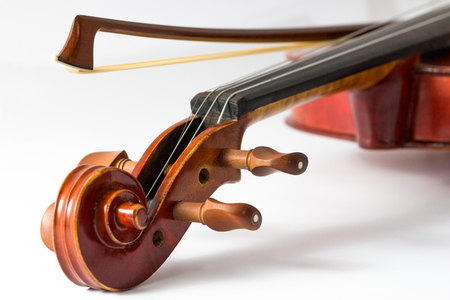 Close up of a violin and bow on white backgroundの写真素材
