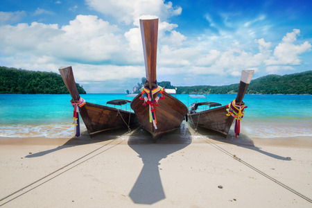 long boat on island in Thailandの写真素材