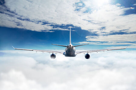 Airplane over the cloudsの写真素材
