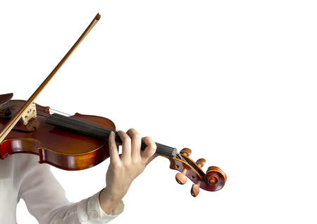 Hand on the strings of a violin over white backgroundの写真素材