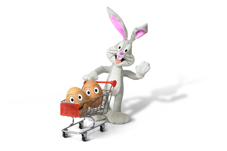 shopping cart with easter eggs and bunnyの写真素材