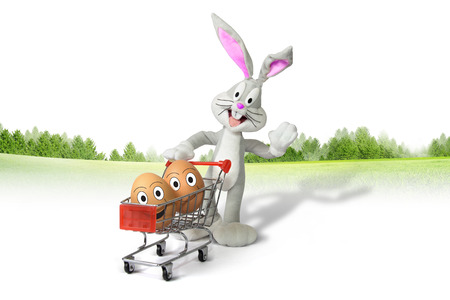shopping cart with easter eggs and bunnyの写真素材