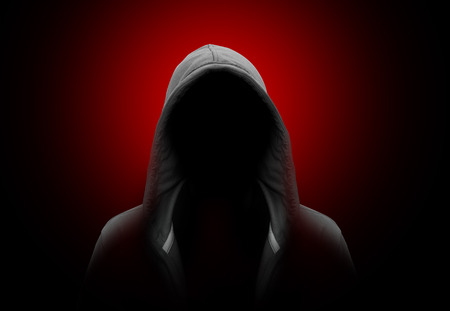 Silhouette of man in the hoodの写真素材