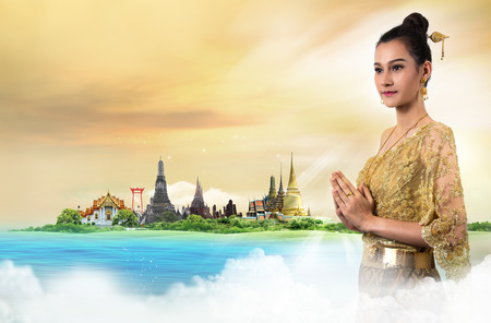 Thai Lady in vintage original Thailand attire Sawasdee action welcome in thai styleの写真素材