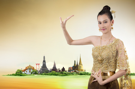 Thai dance woman with thailand travel backgroundの写真素材