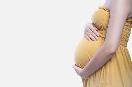 Closeup on tummy of pregnant womanの写真素材