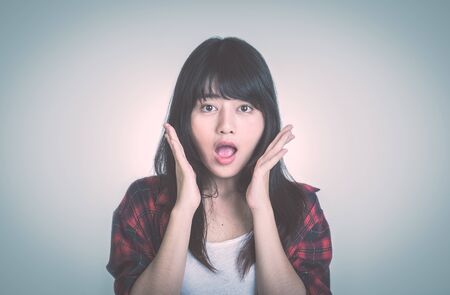 Portrait of a surprised girlの写真素材