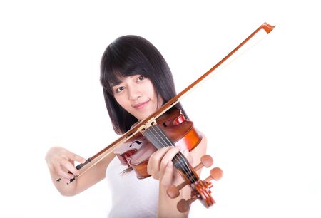 beautiful girl playing the violin, isolated on white backgroundの写真素材