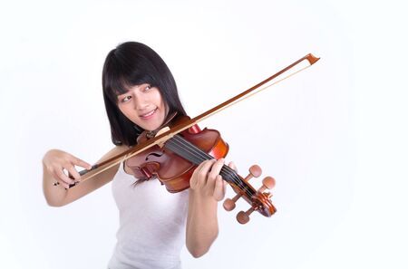 beautiful girl playing the violin, isolated on white backgroundの写真素材