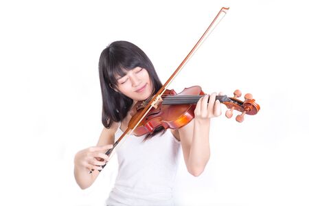 beautiful girl playing the violin, isolated on white backgroundの写真素材