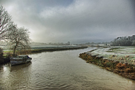 An old boat on the river Arun at Amberleyの写真素材