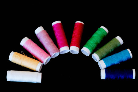 Colourful thread rolls in semicircle