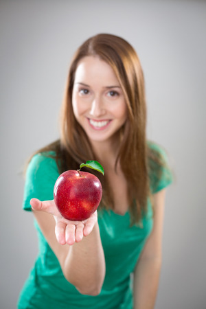 Pretty girl eating appleの写真素材