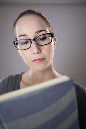 Young Student reading bookの写真素材
