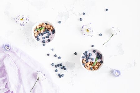 Healthy breakfast with muesli and berries. Flat lay, top viewの写真素材