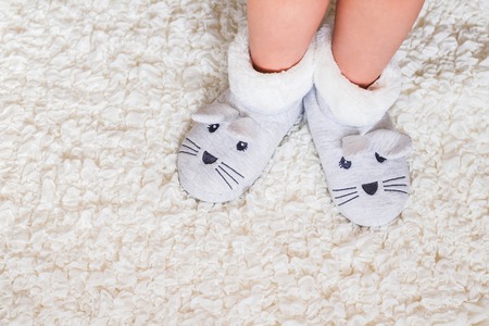 Child's feet in slippers.の写真素材