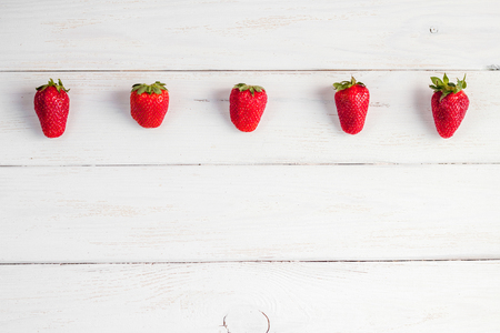strawberry on white wooden backgroundの写真素材