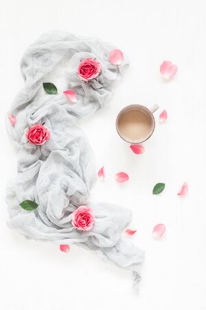 Composition with coffee and rose flowers. Flat lay, top viewの写真素材