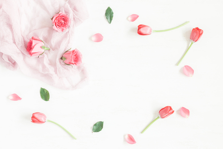 Frame with rose flowers and tulip. Flat lay, top viewの写真素材