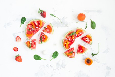 Fruit pizza made of watermelon, strawberry, apricot. Flat lay, top viewの写真素材