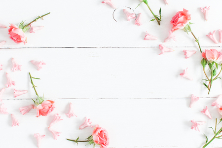 Flowers composition. Pink flowers on white wooden background. Valentine's Day. Flat lay, top viewの写真素材