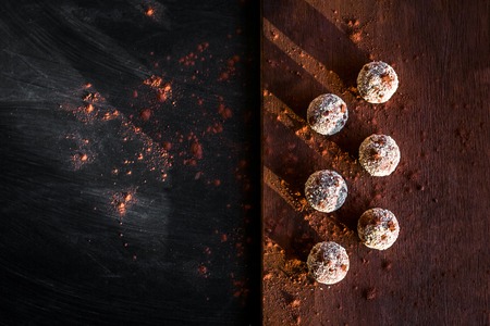 Small chocolate cakes on a cutting boardの写真素材