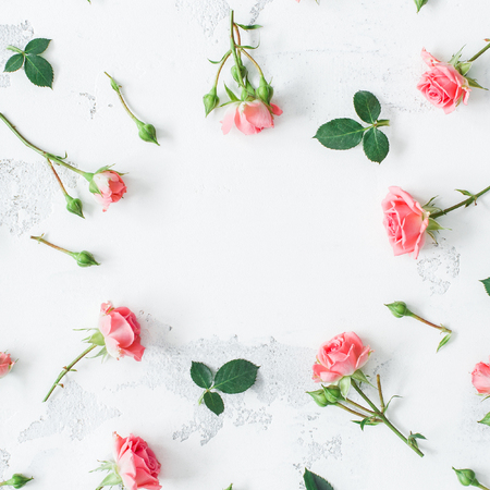 Flowers composition. Frame made of rose flowers. Flat lay, top viewの写真素材