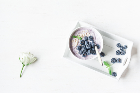 Healthy breakfast with yogurt, muesli and blueberry. Top view, flat layの写真素材