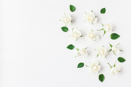 Flowers composition. Frame made of white rose flowers. Flat lay, top viewの写真素材