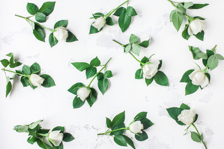 Flowers composition. Pattern made of white rose flowers. Flat lay, top viewの写真素材